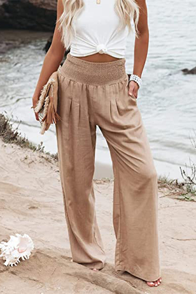 Women's high-waisted palazzo pants in white color.
