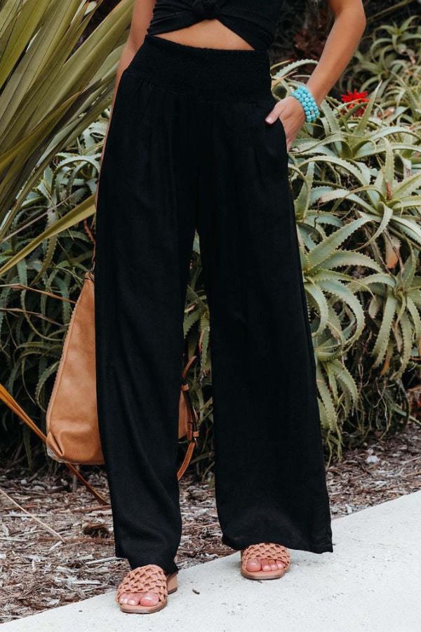 Women's high-waisted palazzo pants in peach color.