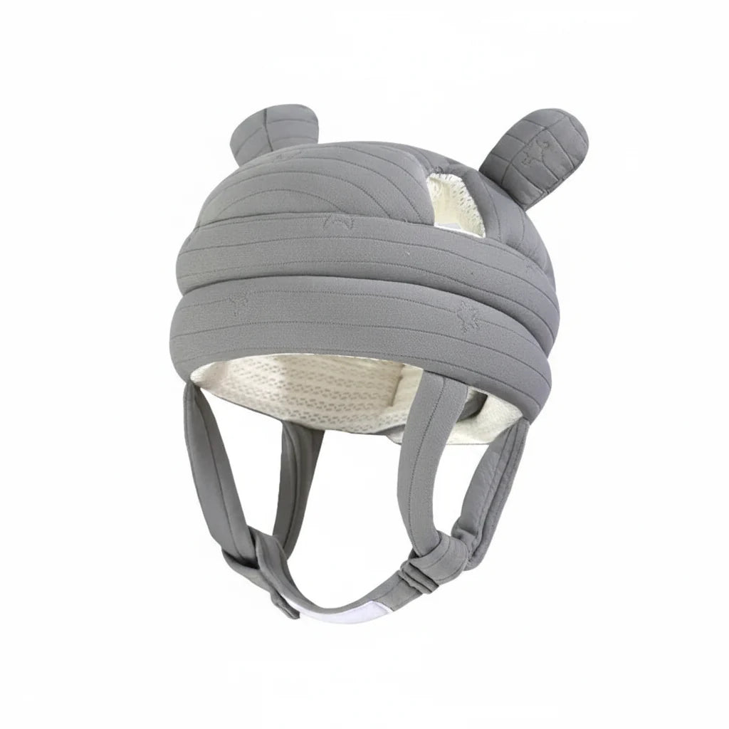 Gray helmet with ear-like features on a light blue background