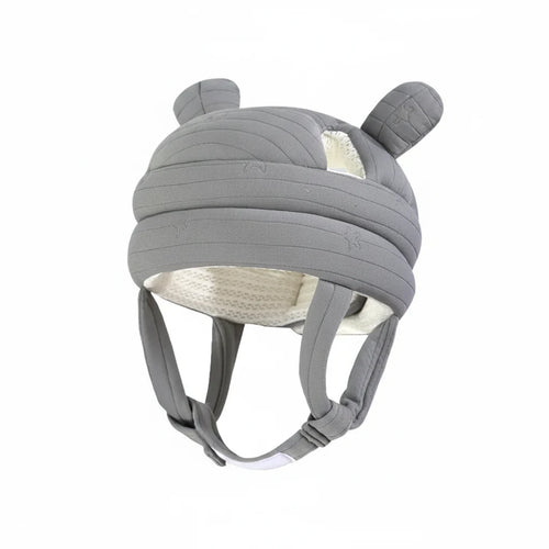 Gray helmet with ear-like features on a light blue background