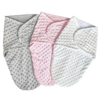 Three baby blankets in gray, pink, and white on a textured surface with 'Multiple colors' text.