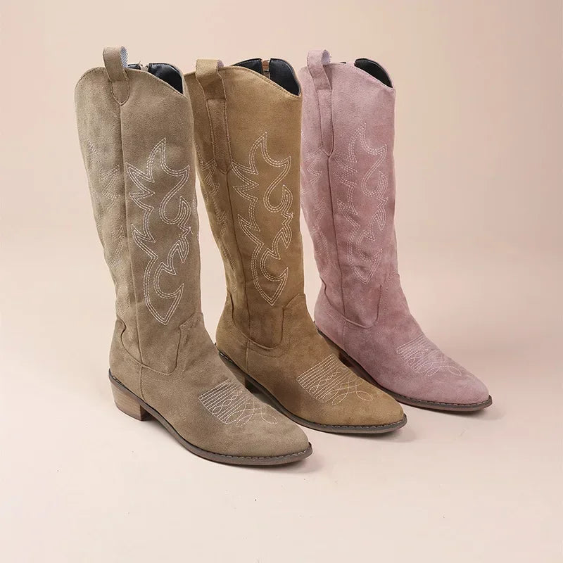 Women's knee-high cowboy boots showcasing detailed embroidery.